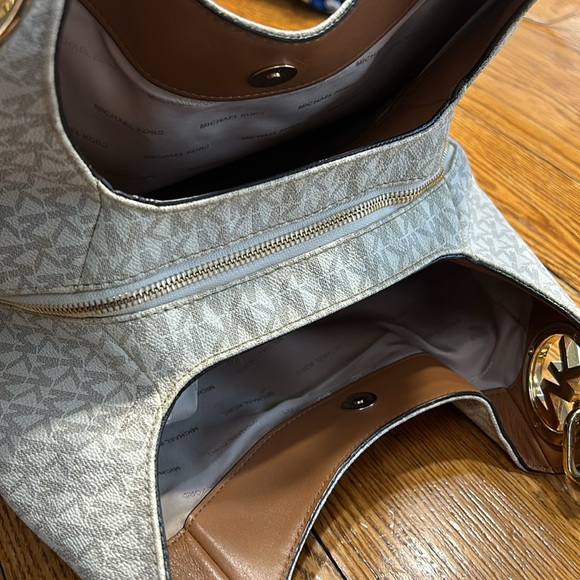 Michael Kors handbag. Vanilla color with tan straps and gold hardware. - Picture 7 of 16